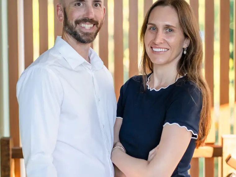 Two Constellation team members standing side by side, relaxed and approachable