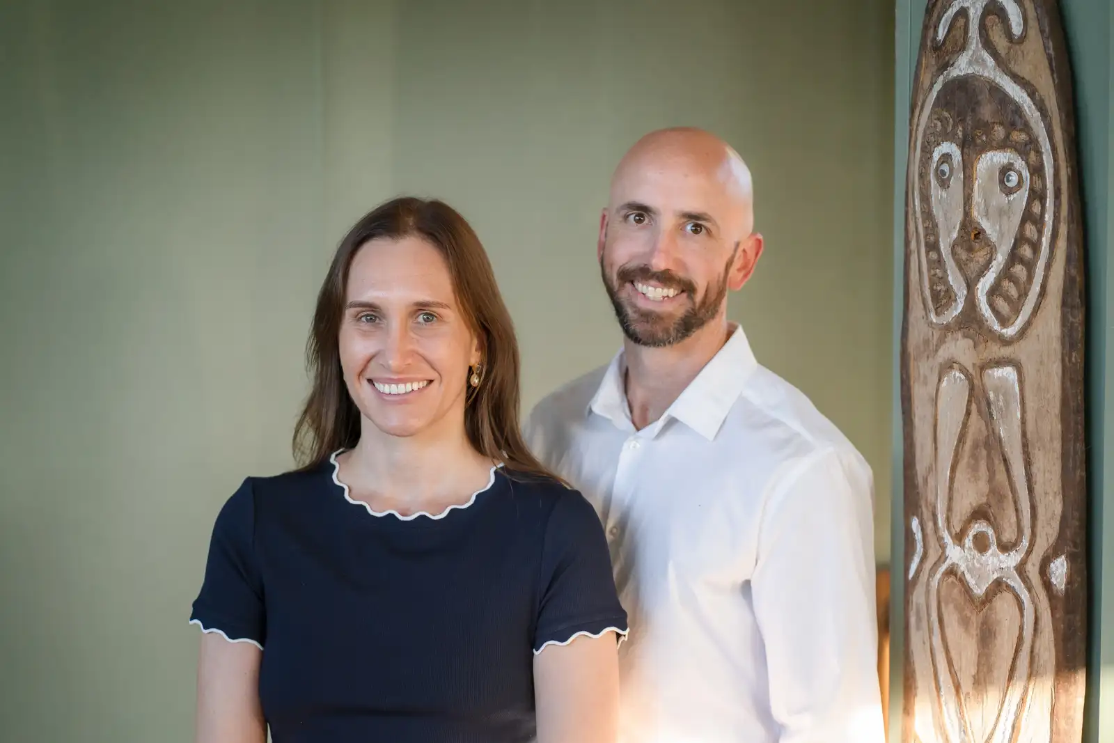 Two Constellation Therapies clinicians standing together in a warm, naturally lit consulting room