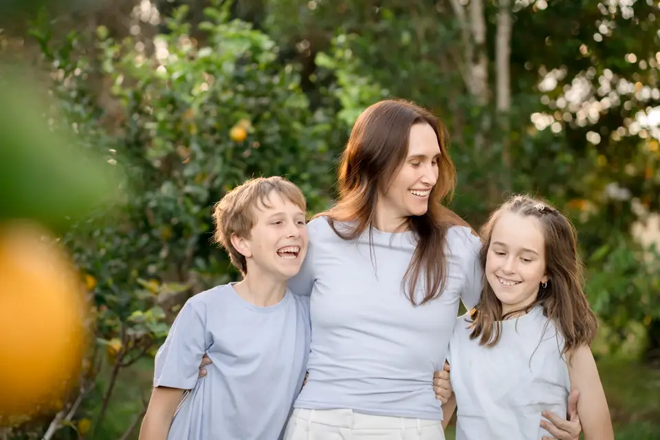 A family together outdoors in golden afternoon light